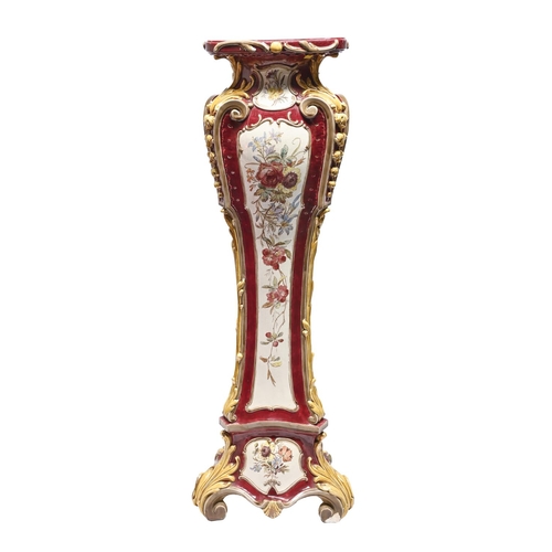 448 - A Continental majolica torchere or pedestal, c1900, printed and painted with flowers reserved on a c... 