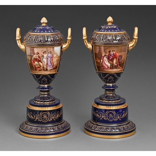 450 - A pair of Vienna style vases, pedestals and covers, c1900, painted by C Heer, one signed, with class... 