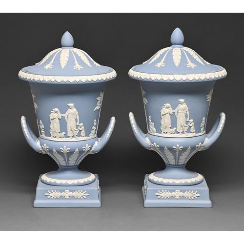 451 - A pair of Wedgwood blue jasper ware campana vases and covers, 20th c, sprigged with An Offering to P... 