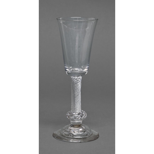 454 - A George II ale glass, the rounded funnel bowl on multiple spiral air twist stem with basal knop and... 