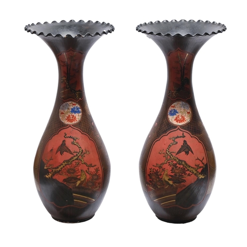 493 - A pair of Japanese lacquered porcelain vases, Meiji period, the fenestrated black, red and gold lacq... 