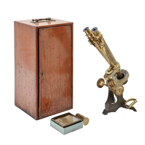 576 - A brass and iron binocular microscope, Watson & Son 313 High Holborn London 1031, with accessori... 