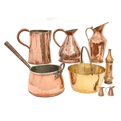 612 - A Victorian copper saucepan, with iron handles, 51cm l, three copper jugs including a Victorian 'hay... 