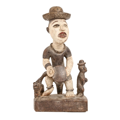 638 - Tribal art. West Africa - a carved wood figure of a seated musician, possibly Ijaw or Urhobo, second... 