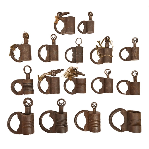 673 - Sixteen Egyptian style iron screw padlocks