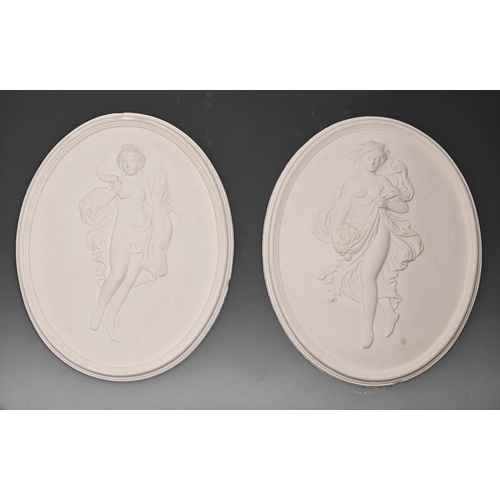 697 - A pair of oval plaster bas reliefs of maidens emblemeatic of Summer and Autumn, 43cm... 