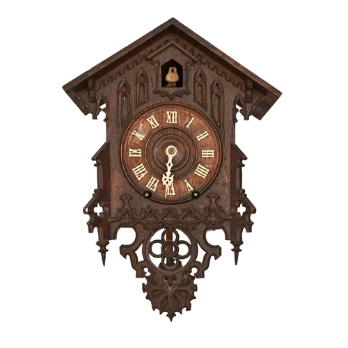 699 - A Black Forest cuckoo clock, c1930, with key and pendulum, 35 x 28cm