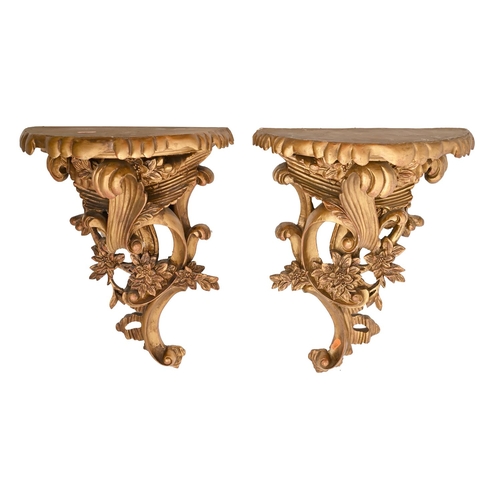 700 - A set of six rococo style gilt resin wall brackets, 20th c, 43cm h