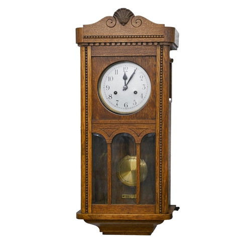 705 - An oak wall clock, c1930, with silvered dial and bevelled glass panels, 78 x 33cm