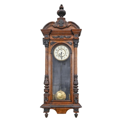 706 - A walnut Vienna wall clock, c1900, with primrose enamel dial, pendulum and weights, 132cm h and a sm... 