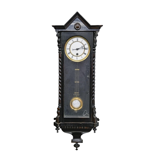 706 - A walnut Vienna wall clock, c1900, with primrose enamel dial, pendulum and weights, 132cm h and a sm... 