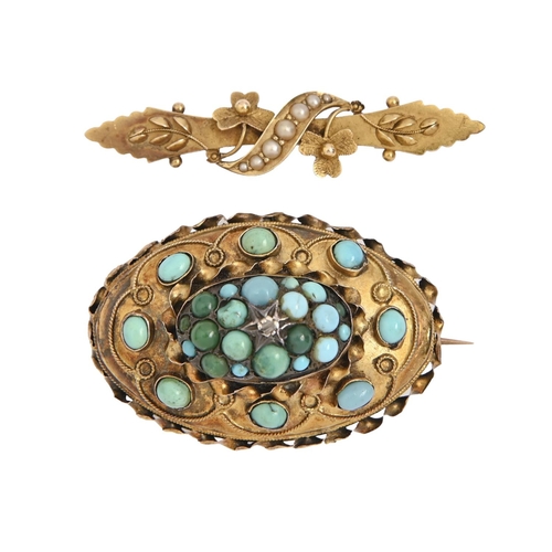 90 - A Victorian turquoise brooch, of domed oval shape with filigree decoration, 40mm l, marked 15ct and ... 