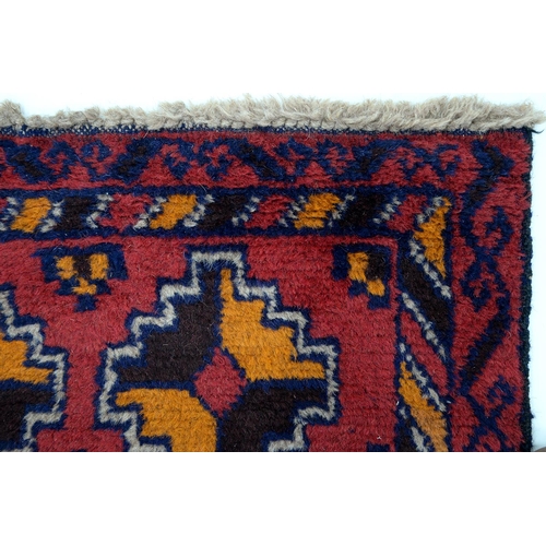 930 - An Afghan Baluch rug, 135 x 84cm