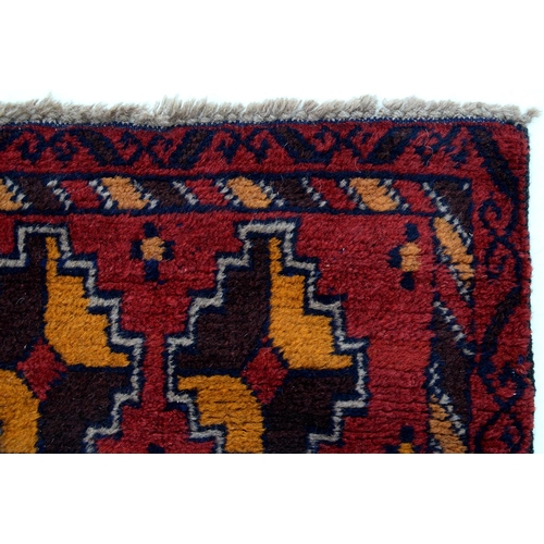 930 - An Afghan Baluch rug, 135 x 84cm