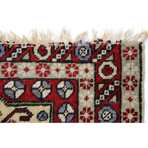 932 - An Antique Turkish rug and an Indian mat, 120 x 84cm and 58 x 41cm (2)