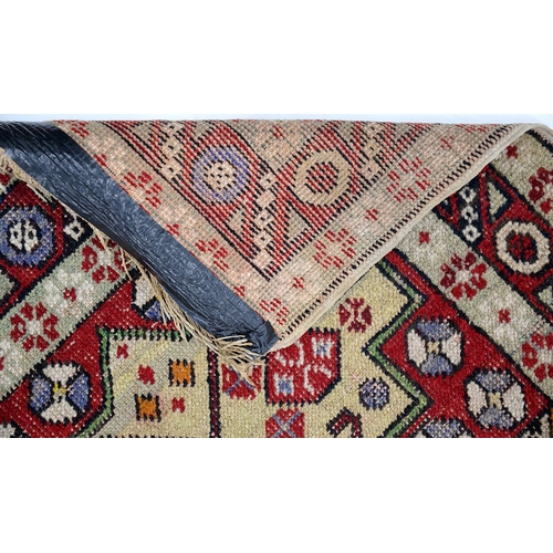 932 - An Antique Turkish rug and an Indian mat, 120 x 84cm and 58 x 41cm (2)