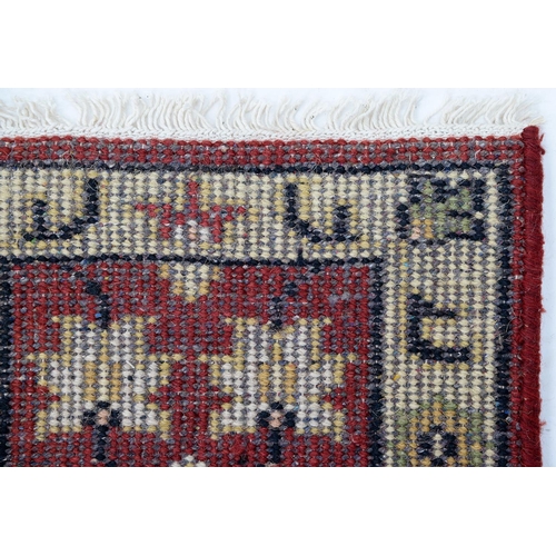 932 - An Antique Turkish rug and an Indian mat, 120 x 84cm and 58 x 41cm (2)