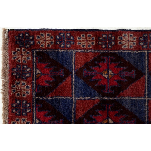 943 - A Persian Baluch rug, 134 x 80cm