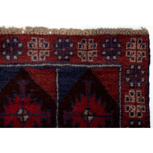 943 - A Persian Baluch rug, 134 x 80cm