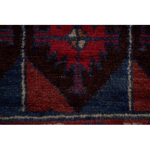 943 - A Persian Baluch rug, 134 x 80cm