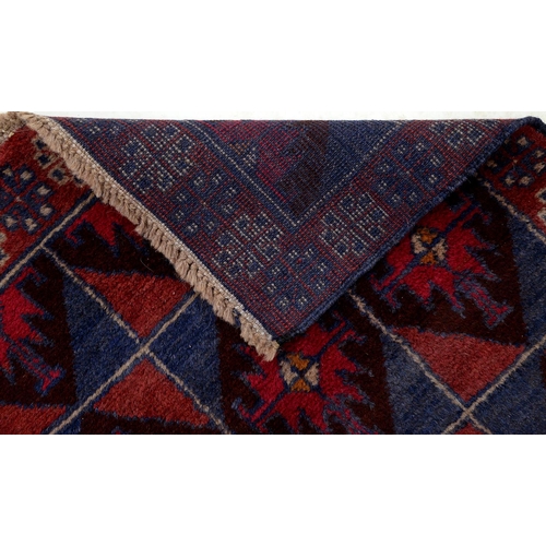 943 - A Persian Baluch rug, 134 x 80cm