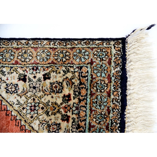 957 - A Persian Ghom silk rug, 81 x 55cm