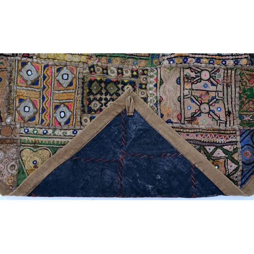 959 - An Indian Banjara rug and machine made rug, 125 x 69cm and 50 x 44cm (2)