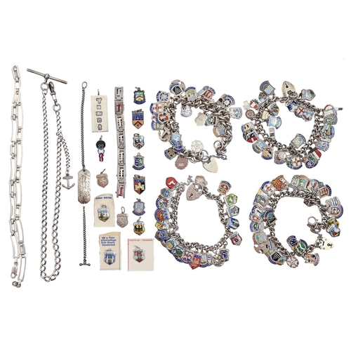 97 - Four silver charm bracelets, with an extensive collection of enamelled silver shields and various ot... 