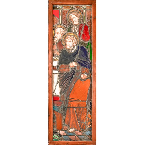 704 - A Victorian stained glass window light of three saints, 188 x 61.5cm including wood frame... 