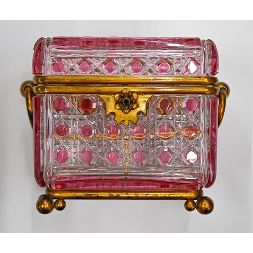 453A - A French gilt lacquered brass mounted pink flashed and cut glass scent casket and set of six square ... 