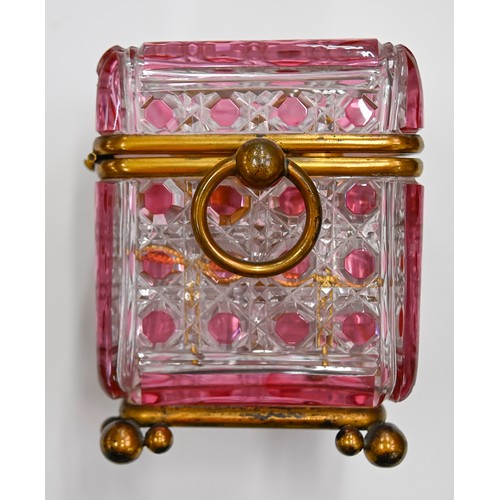 453A - A French gilt lacquered brass mounted pink flashed and cut glass scent casket and set of six square ... 