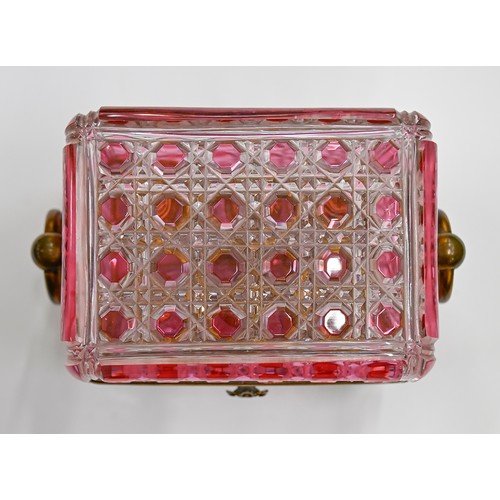 453A - A French gilt lacquered brass mounted pink flashed and cut glass scent casket and set of six square ... 