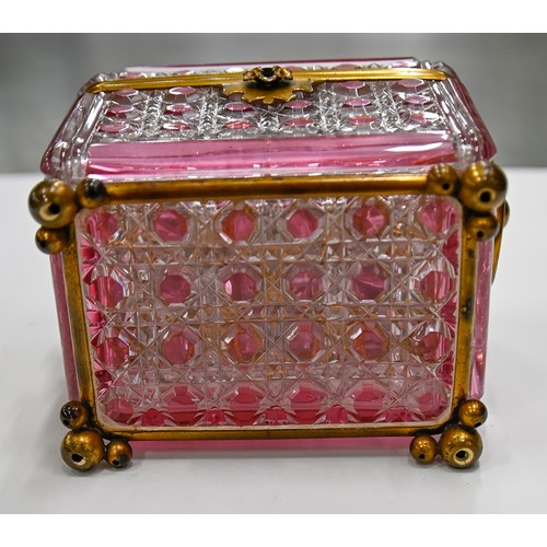 453A - A French gilt lacquered brass mounted pink flashed and cut glass scent casket and set of six square ... 