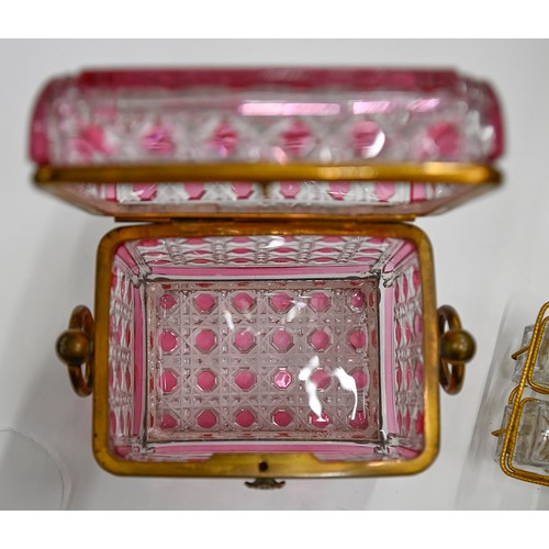 453A - A French gilt lacquered brass mounted pink flashed and cut glass scent casket and set of six square ... 