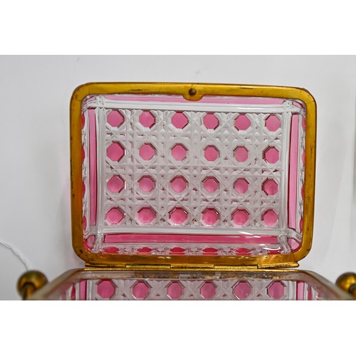 453A - A French gilt lacquered brass mounted pink flashed and cut glass scent casket and set of six square ... 