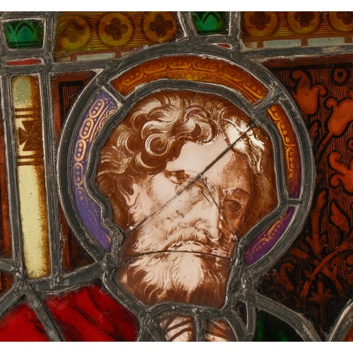 704 - A Victorian stained glass window light of three saints, 188 x 61.5cm including wood frame... 