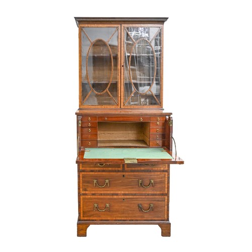 1055 - A Regency mahogany secretaire bookcase, crossbanded in satinwood and line inlaid, the upper part wit... 