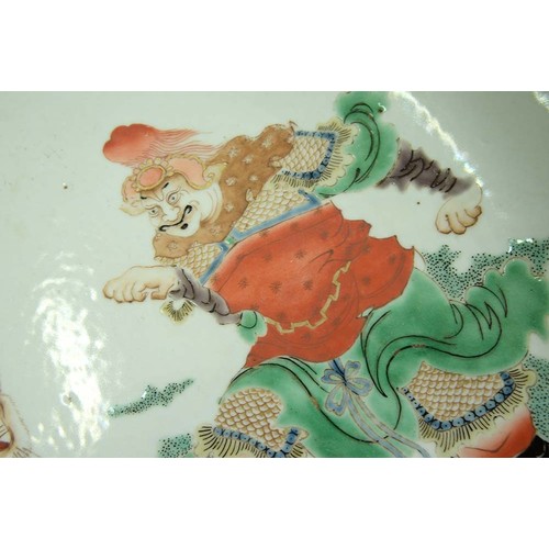 436 - A Chinese famille verte dish, 19th c, enamelled with a ferocious tiger and equally ferocious man, th... 