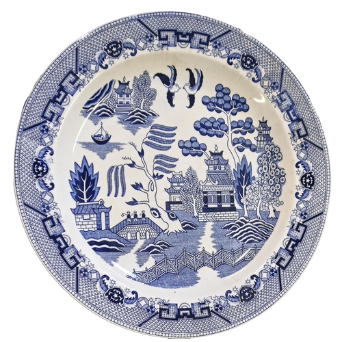 513 - A quantity of Booths Willow pattern and other blue and white dinner ware, etc, early 20th c and late... 