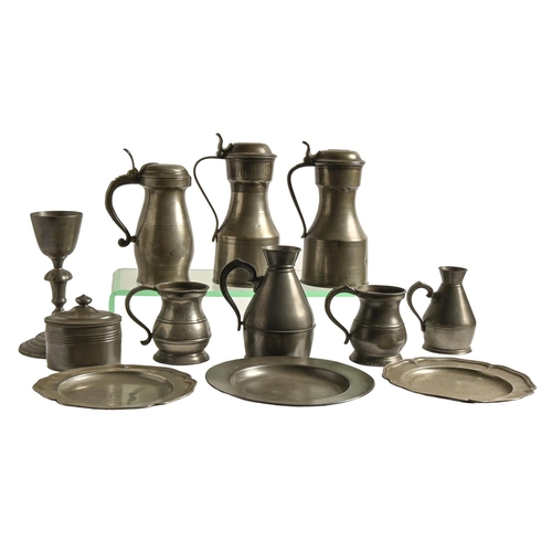 570 - A quantity of early 19th c and later pewter ware, including tankards, measures, jugs and plates... 