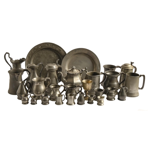 570 - A quantity of early 19th c and later pewter ware, including tankards, measures, jugs and plates... 