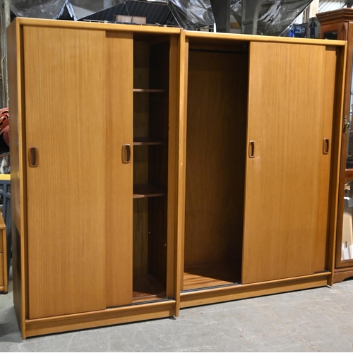 612 - A 1970’s Austine Suite three-piece teak bedroom suite, the mirror back dressing table 144cm w ... 