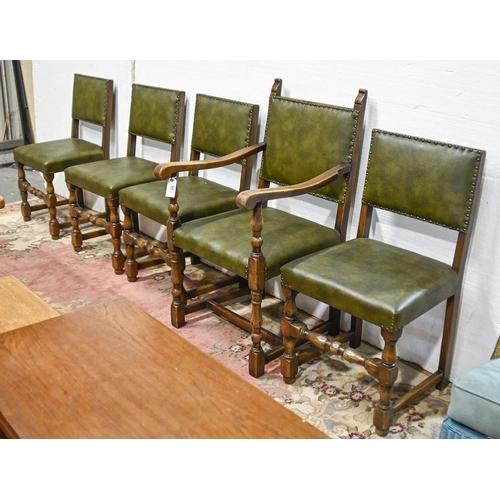 627 - A set of five oak dining chairs, covered in green leather, including an elbow chair