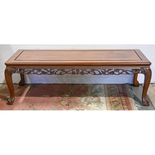 630 - A South East Asian carved hardwood coffee table, 40cm h; 127 x 51cm