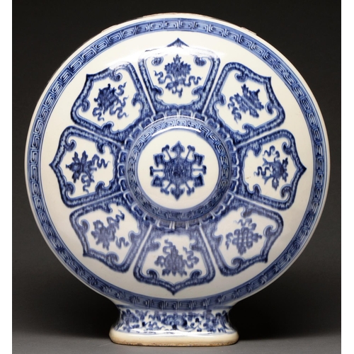 499 - A Chinese blue and white moon flask, painted in the manner of ‘heaping and piling’ with lotus medall... 