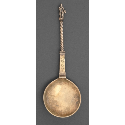 145 - A Dutch silver gilt apostle spoon, the round bowl on engraved pillar shaped and spiral stem terminat... 