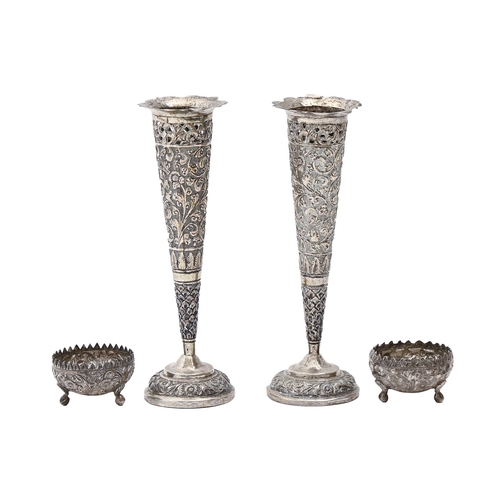 171 - A pair of South East Asian silver repousse vases and pair of salt cellars, c1900, vase 17.5cm h, 6oz... 