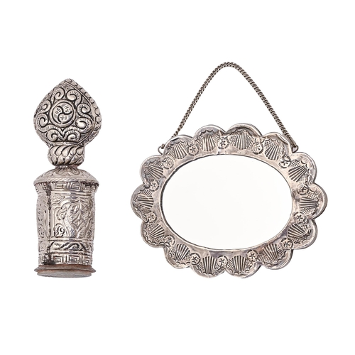 231 - A Turkish silver repousse mirror, 20th c, of cusped oval shape with chain handle, 14cm l, marked ORN... 