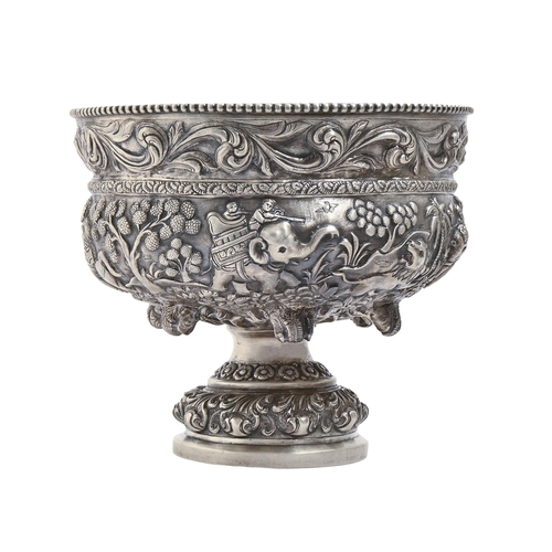 250 - An Indian silver repousse footed bowl, Lucknow, late 19th c, chased in high relief with hunting scen... 