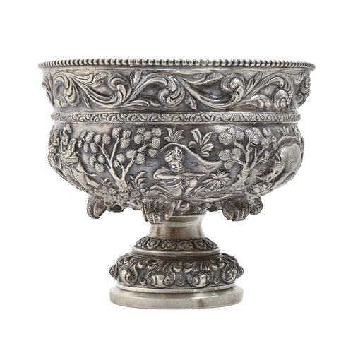 250 - An Indian silver repousse footed bowl, Lucknow, late 19th c, chased in high relief with hunting scen... 